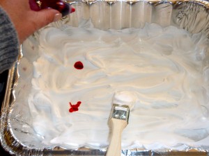 Adding some red food coloring drops to the shaving cream