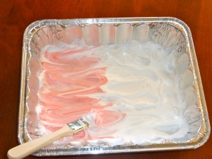 Mixing the food coloring into the shaving cream